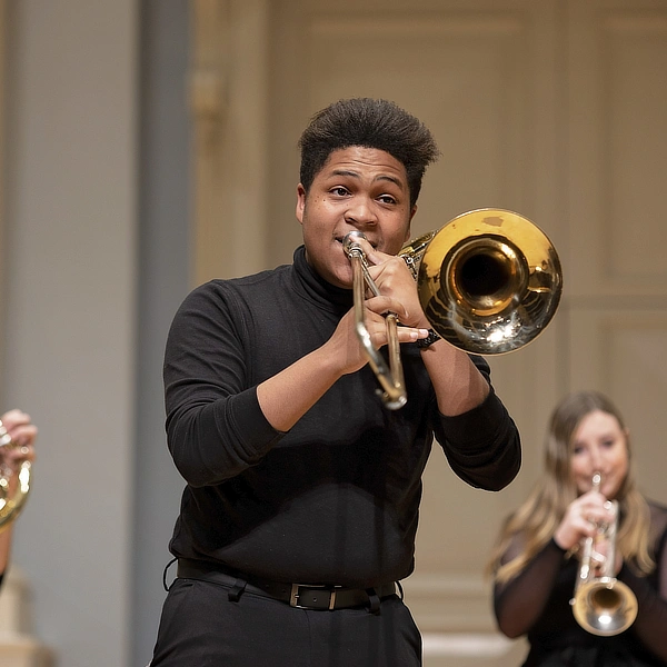 male student playing the trumpet DR04182023193