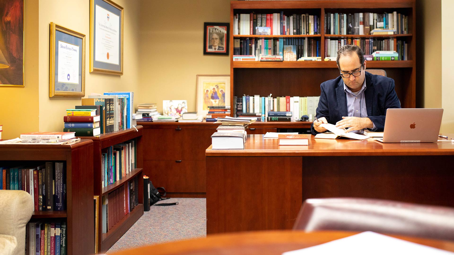 Faculty Member at Desk