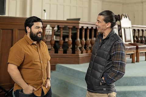 Two Men Conversing in Church