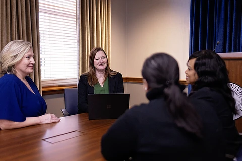 four women meeting