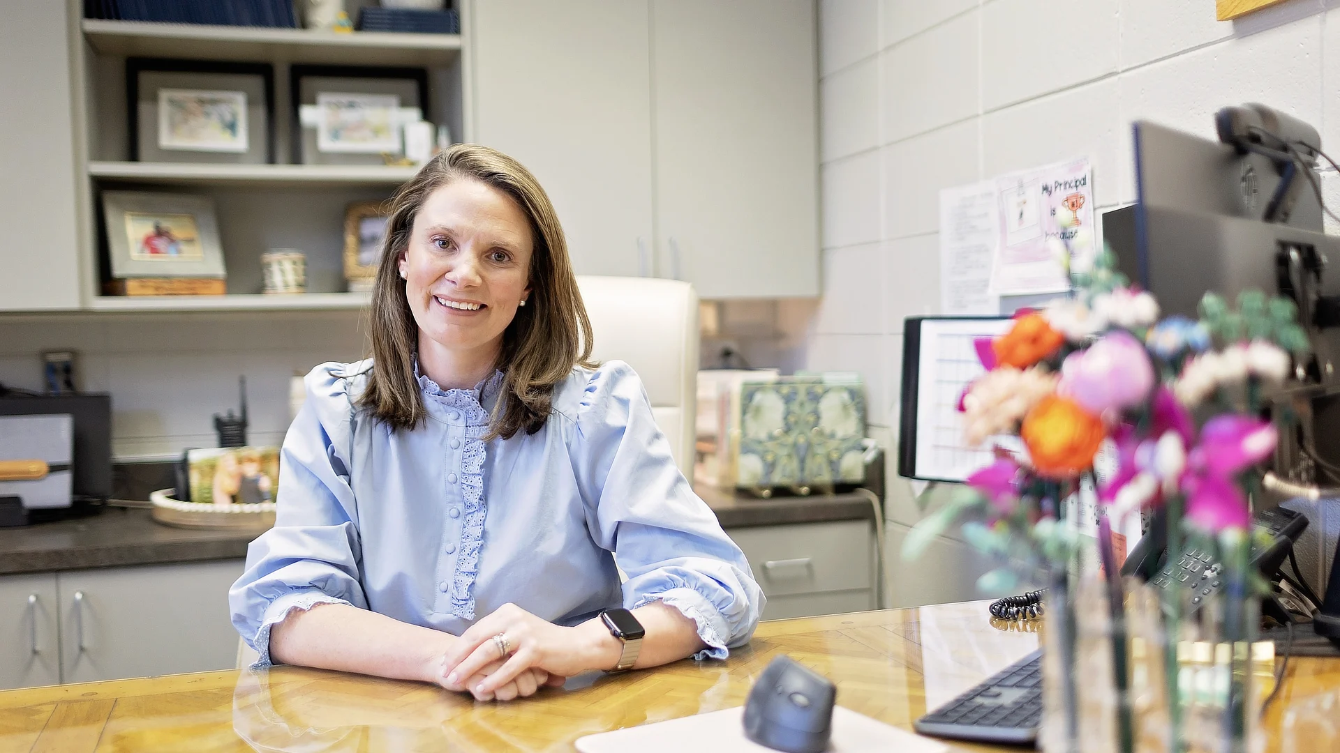 female student sitting at a kitchen counter