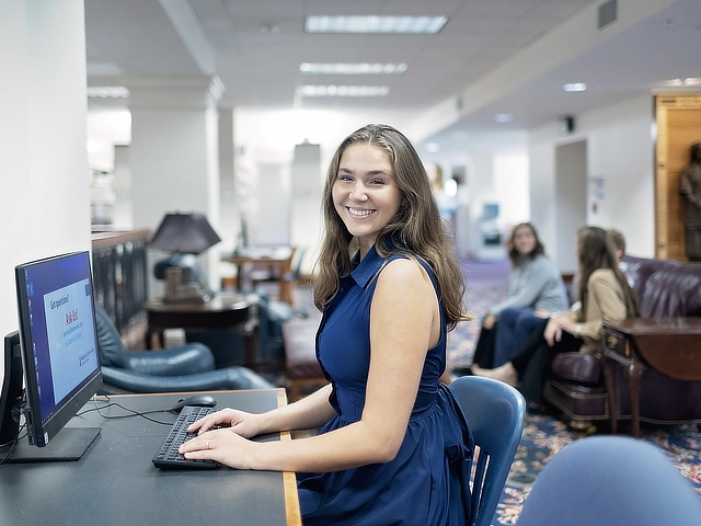 female student working at computer