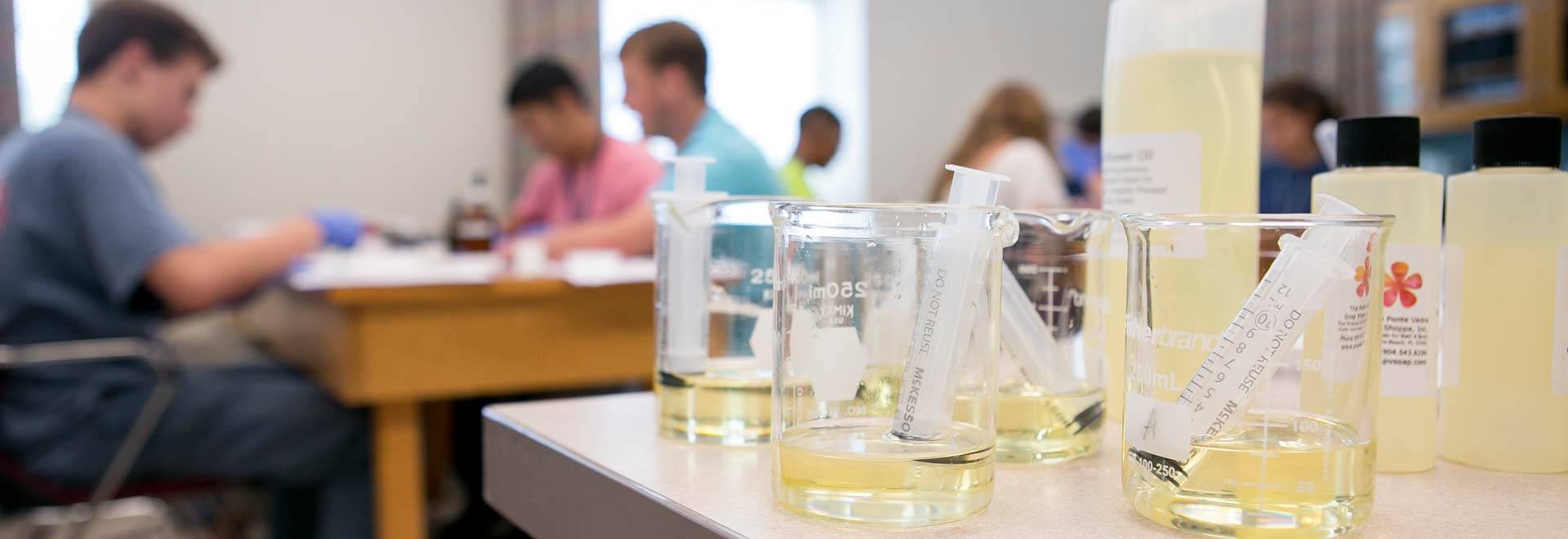 beakers and students at camp