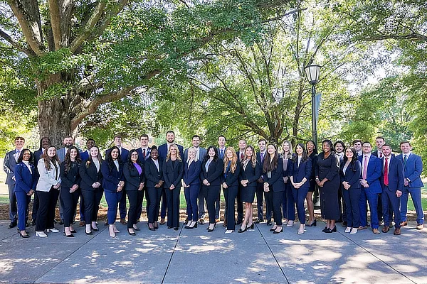 group of law students and professors in the quad