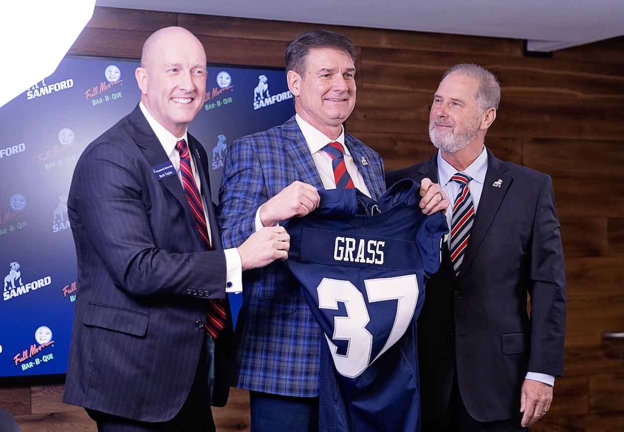 John Grass Displays Samford Jersey at News Conference