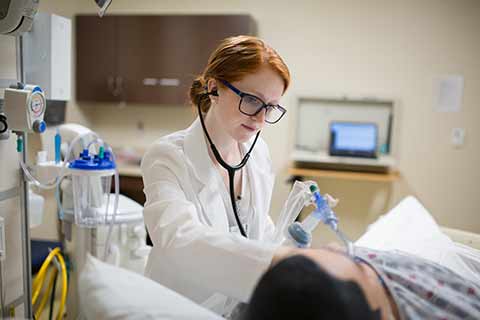 female nurse with simulated patient