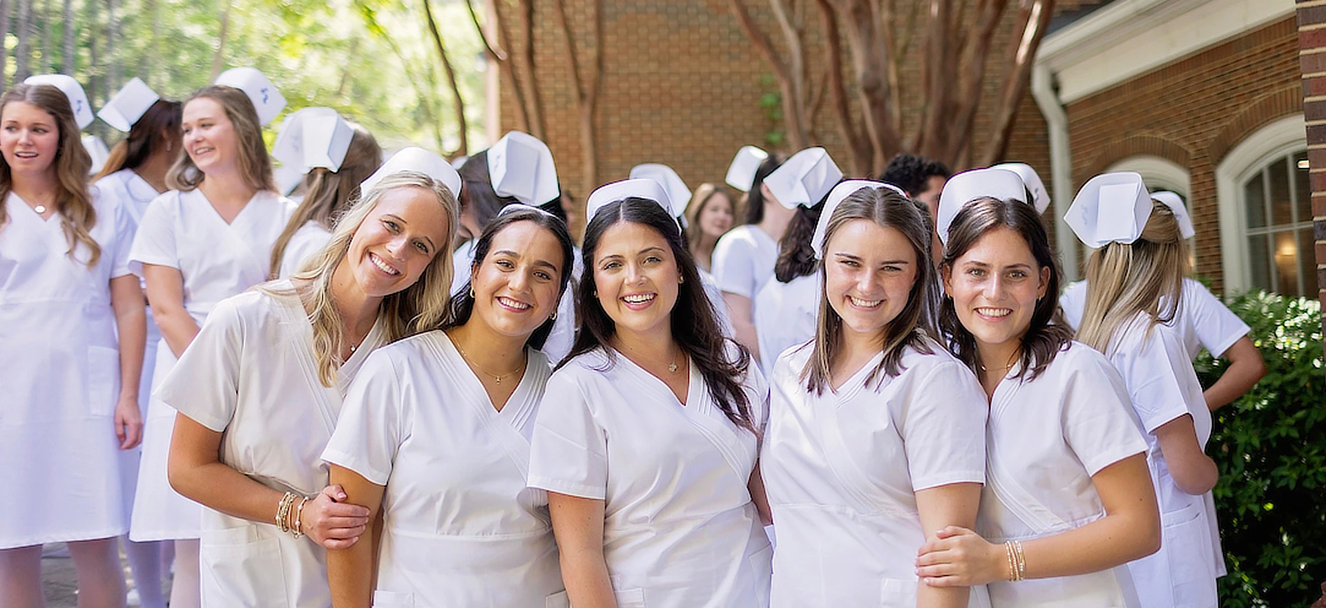 five female nursing students smiling