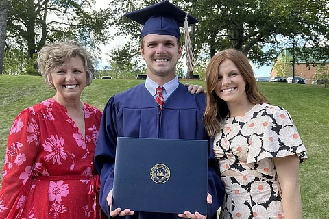 Cameron Kosid with a diploma