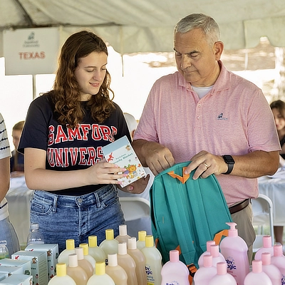 student and dad packing bags