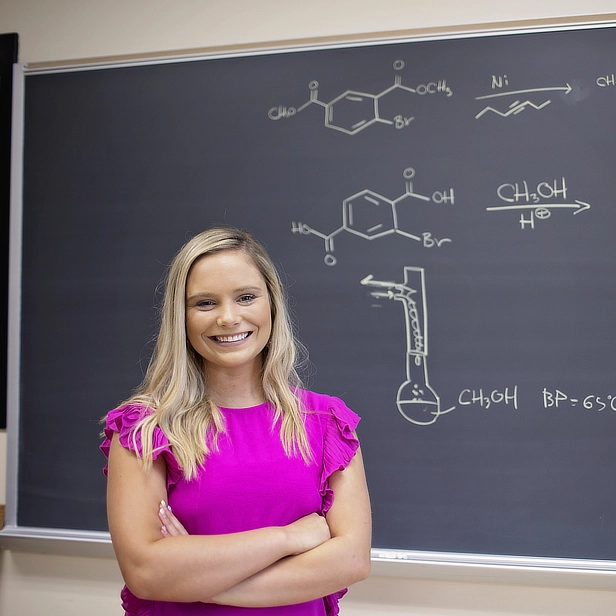 Female Student at Chalkboard