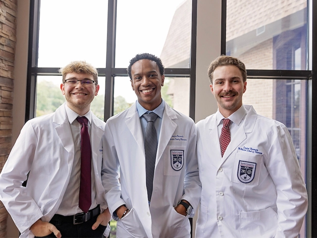 three students male white cat