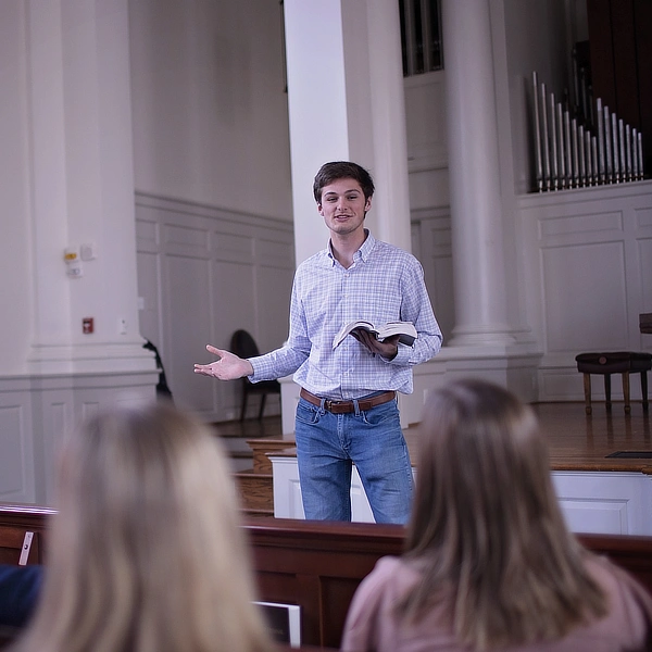 male student preaching