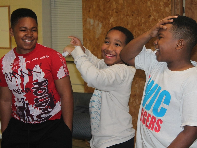 three boys laughing