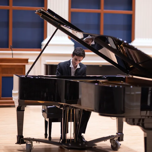 Male Student at Grand Piano