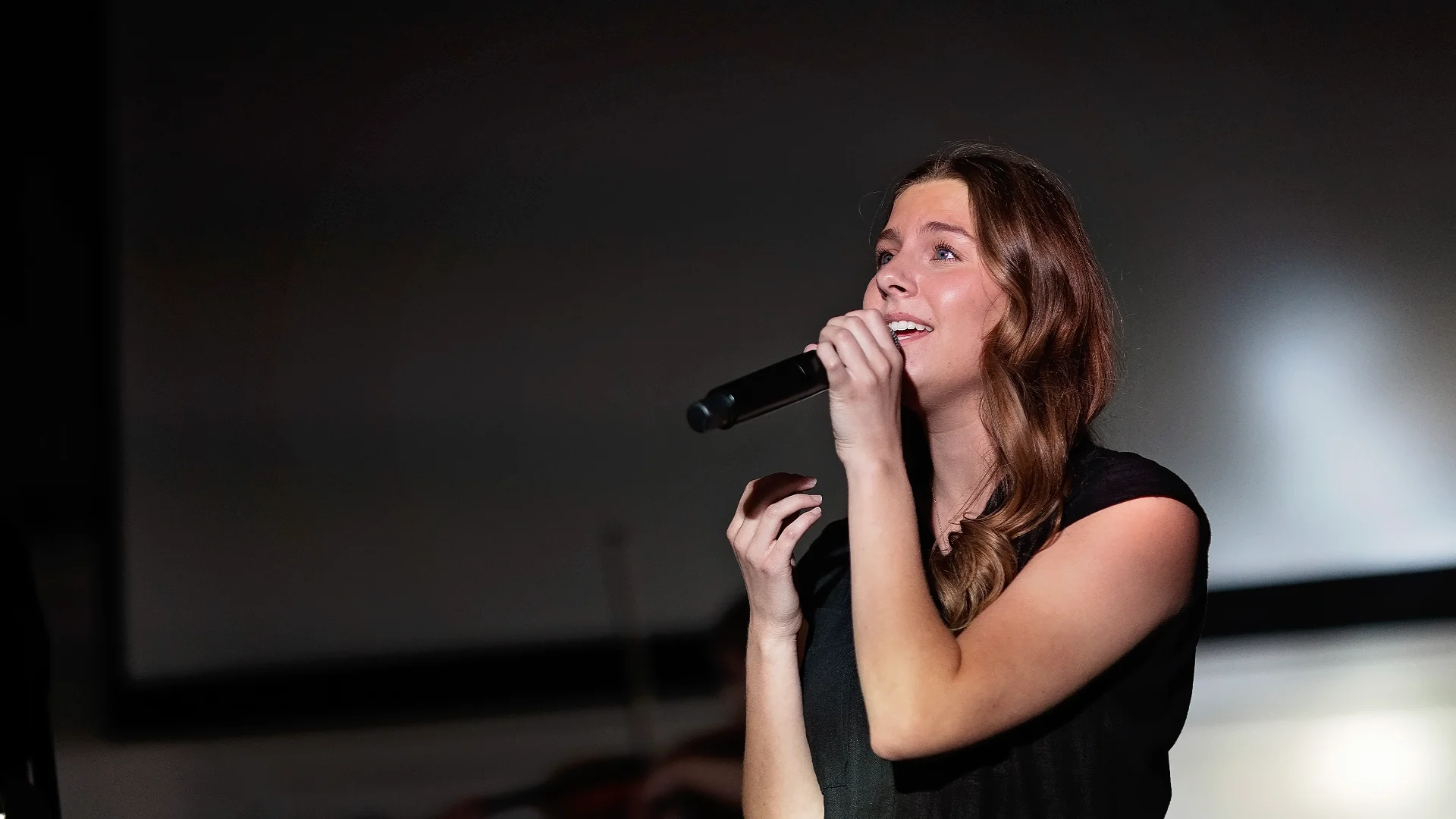 Vocalist Singing into a Microphone