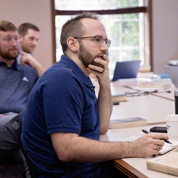 PhD Students around a table