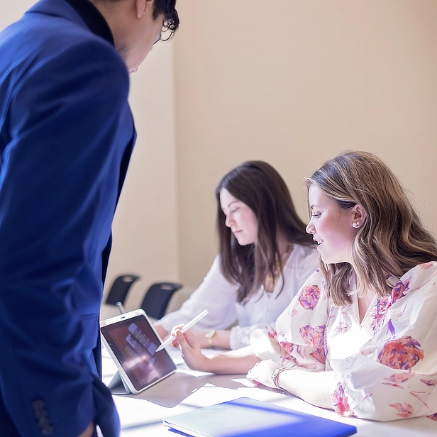 Students around tablet