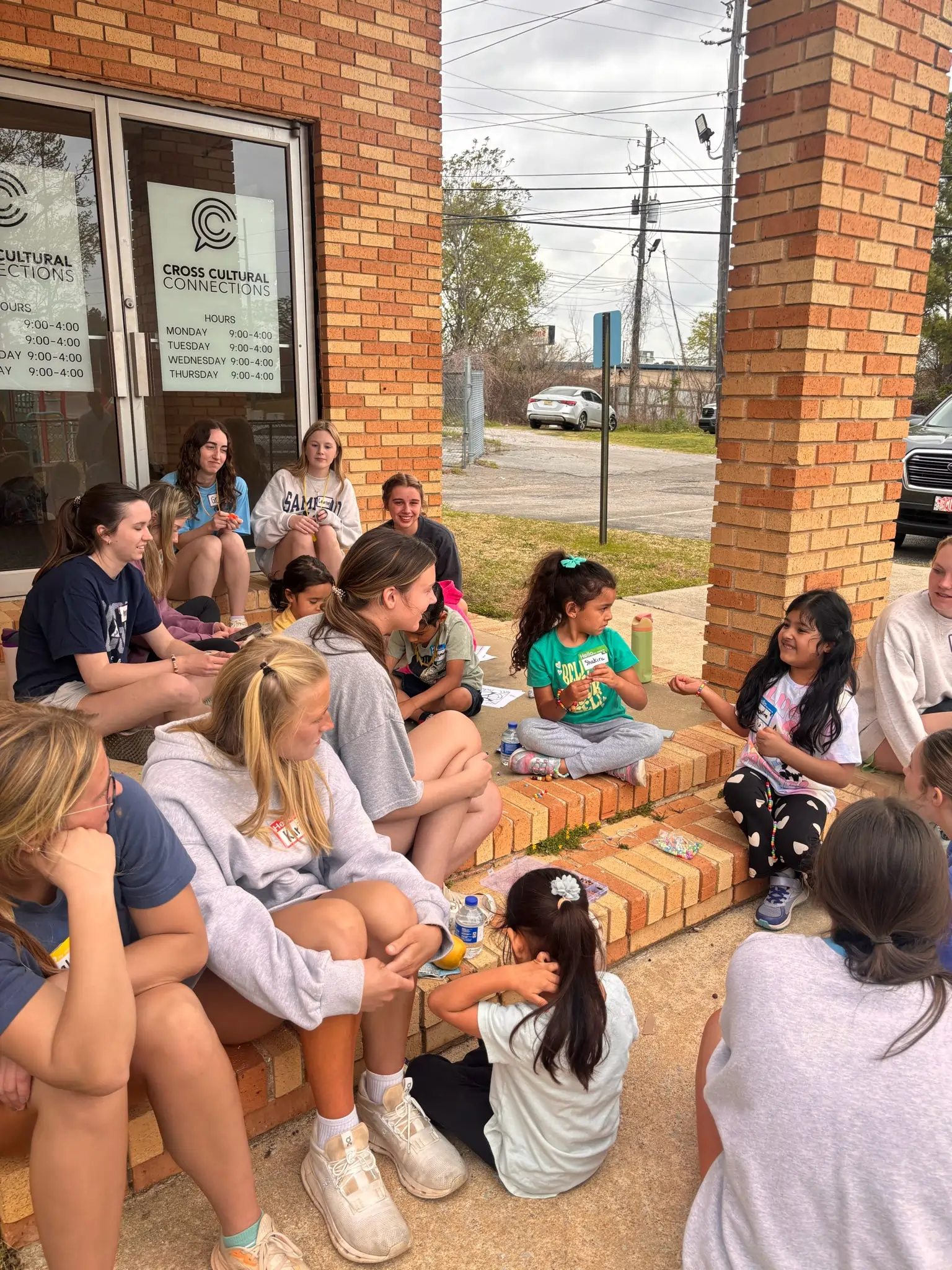 students-with-kids-volunteer.webp
